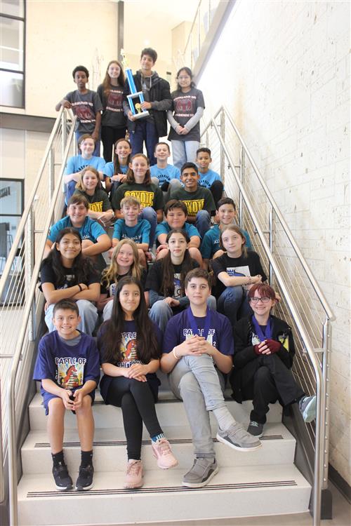 a group of students sitting on the stairs