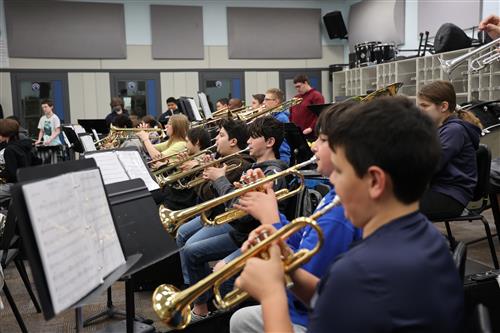 Students play trumpets