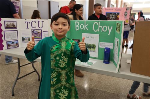a boy dressed a boy chow