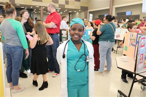 a girl dressed as a doctor