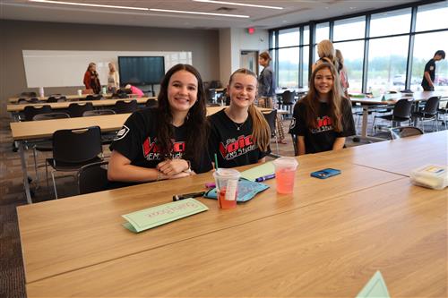 Three girls smiling