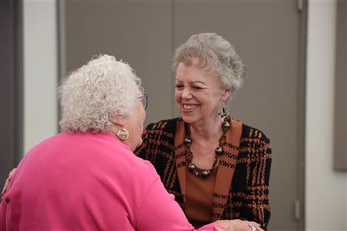Two women smiling