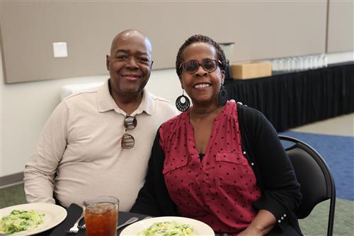A man and a woman sitting at a table