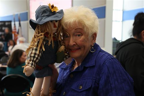 Woman and a scarecrow