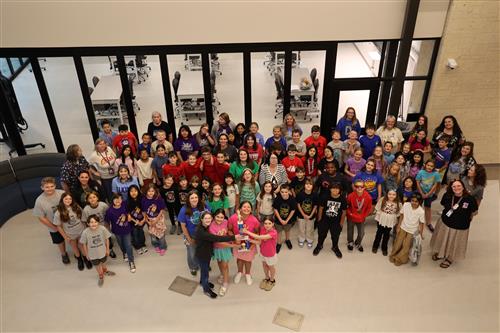 a large group of students and teachers