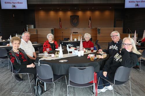 A group of people sitting around a table