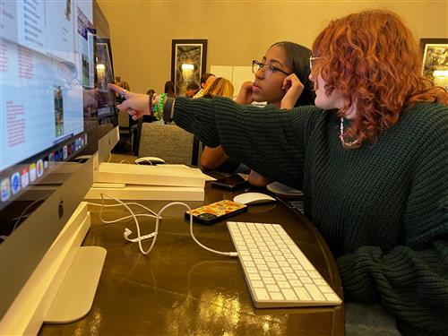 Chisholm Trail High School students working on yearbook in classroom