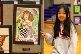  Elementary student with their artwork