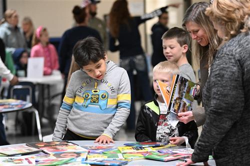 A boy looks at a book