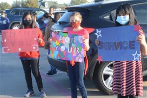 Students hold veteran supporting signs at Bryson Elementary 