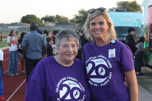 Two women standing together