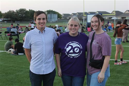 A man and two women standing together