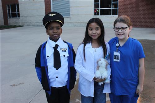 studnets dressed as a pilot, veterinarian and medical professional