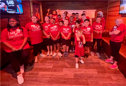 EMS ISD TrailBlazers Pose Under a Red Light