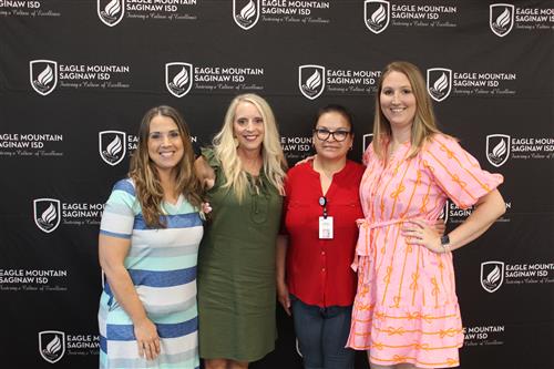 a group of women stand together