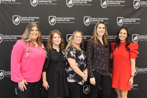 a group of women stand together