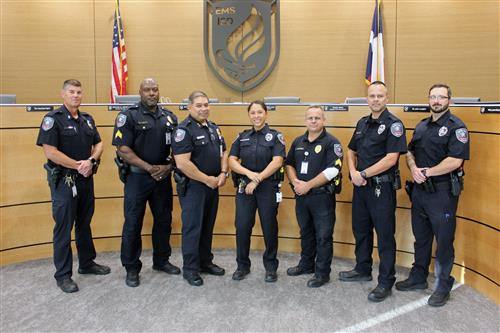 7 EMS ISD Police Officer standing together