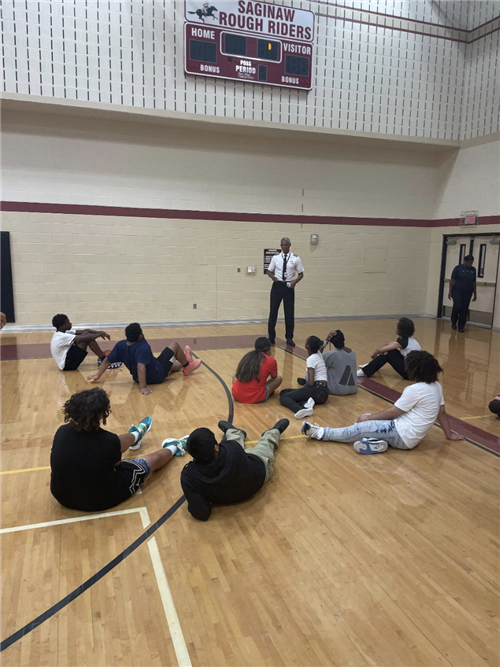 A Military Member speaks to students