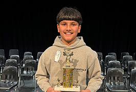  A boy holding a trophy