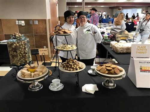 Culinary students pose with the cookies they served at Taste of Northwest. 