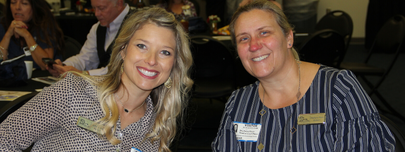 Realtors smile for a photo