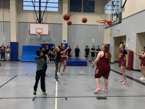 SHS basketball players teach Gililland students how to shoot the ball