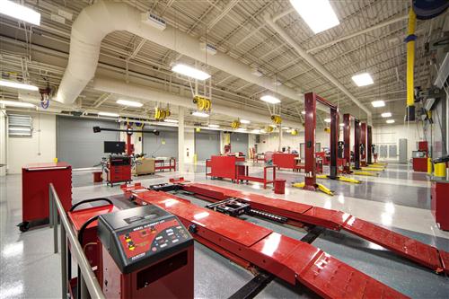 Shop photo with automotive bays and lifts