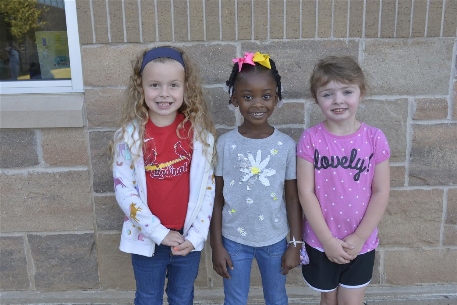 Kindergarteners smiles outside