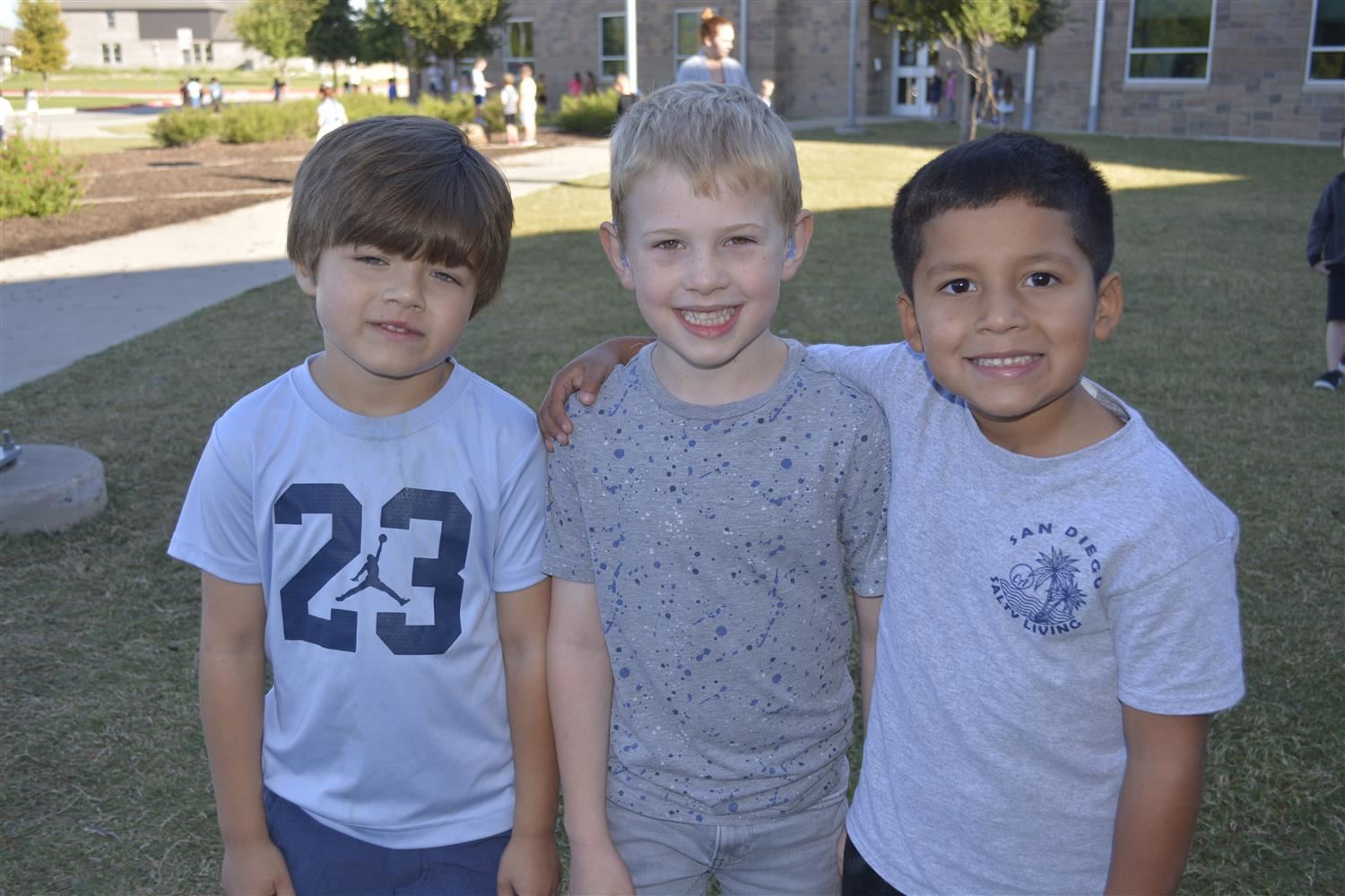 Kindergarteners smiles outside