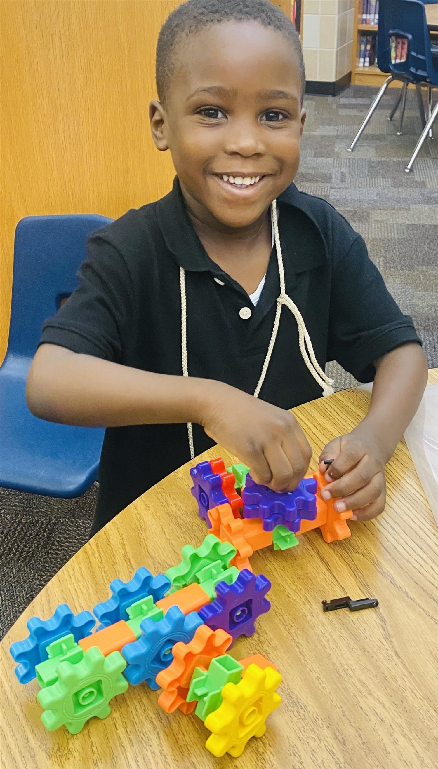 students works with blocks in the library